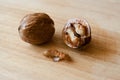 Walnuts lie on a wooden surface Royalty Free Stock Photo