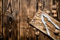 Walnuts with Nutcracker on the Board. Royalty Free Stock Photo