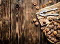 Walnuts with Nutcracker on the Board. Royalty Free Stock Photo