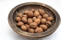 Walnuts in old handmade wooden bowl