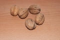 Walnuts on old rustic table in wooden bowl, Pile of Walnut kernels, Walnut background Royalty Free Stock Photo