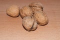 Walnuts on old rustic table in wooden bowl, Pile of Walnut kernels, Walnut background Royalty Free Stock Photo