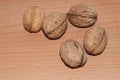 Walnuts on old rustic table in wooden bowl, Pile of Walnut kernels, Walnut background Royalty Free Stock Photo