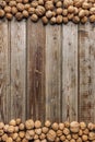 Walnuts on old vintage wooden background. Wood boards. Natural wood. Rustic style. The view from the top. Space for text Royalty Free Stock Photo