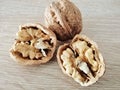 Walnuts, one whole and one divided with walnut kernel, close up Royalty Free Stock Photo