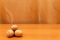 Walnuts on the orange table. Golden background. Walnuts are in the corner Royalty Free Stock Photo