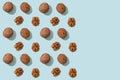 Walnuts pattern, whole and peeled on blue background with copy space. Top views of the nuts and seeds. Wrapping paper, poster,