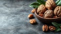 Walnuts and Pecans in Wooden Bowl on Dark Background with Leaves Royalty Free Stock Photo
