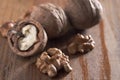 Walnuts peeled and inshell. Brown wooden table. Healthy nutrition, health care, diet. Healthy, fresh and nutritious food Royalty Free Stock Photo