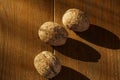 Walnuts on a rustic old wooden table. Three walnuts on a wooden table. Side view. Royalty Free Stock Photo