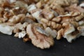 walnuts scattered on a black table