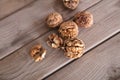 Walnuts scattered on wooden background