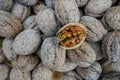 Walnuts in Shell with One Open Nut Close Up Texture Background Royalty Free Stock Photo
