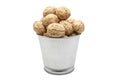 Walnuts in a tin bucket on white background. Wiyh clipping path