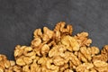 Walnuts. Walnut kernels on dark black stone background. Top view, flat lay Royalty Free Stock Photo