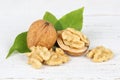Walnuts walnut nuts nut nutshell on wooden board Royalty Free Stock Photo