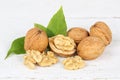 Walnuts walnut nuts on wooden board Royalty Free Stock Photo