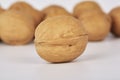 Walnuts on a white background one nut in the foreground Royalty Free Stock Photo