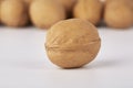 Walnuts on a white background, one nut in the foreground Royalty Free Stock Photo