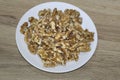 Walnuts on a white plate Royalty Free Stock Photo