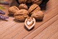 Walnuts in a wicker basket, lavender flowers. Healthy eating Royalty Free Stock Photo