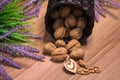 Walnuts in a wicker basket, lavender flowers. Healthy eating Royalty Free Stock Photo