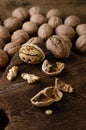 Walnuts on wooden background. Vegetarian, brain nutrition. Close up, vertical Royalty Free Stock Photo