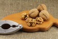 Walnuts on a wooden board (cutting board) with a nutcracker Royalty Free Stock Photo