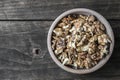 Walnuts in wooden bowl on wooden table Royalty Free Stock Photo