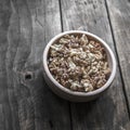 Walnuts in wooden bowl on wooden table Royalty Free Stock Photo