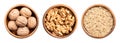 Walnuts, with and without shells, and ground, in wooden bowls Royalty Free Stock Photo