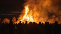 Walpurgis Night Bonfire. Silhouetted Crowd at Bonfire Night