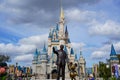 Walt Disney and Mickey Mouse Partners statue in front of Cinderellas Castle