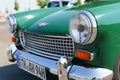 A vintage Austin Healey Sprite Mark 4. Front view of the bumper, hood, grille and headlights.