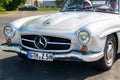 A vintage MERCEDES-BENZ 190 SL. Front view of the bumper, hood, grille and headlights.