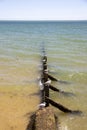 Groynes on the beach at high tide. Walton on the Naze  Essex  United Kingdom  July Royalty Free Stock Photo