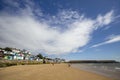 Wooden beach huts and pier on the coastline. Walton on the Naze  Essex  United Royalty Free Stock Photo