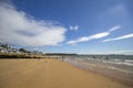 Wooden beach huts and pier on the coastline. Walton on the Naze  Essex  United Royalty Free Stock Photo