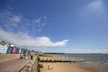 Wooden beach huts and pier on the coastline. Walton on the Naze Essex United