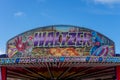 A waltzer fairground ride sign with lights