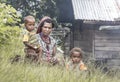Dani tribe woman with kids resting