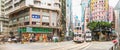 Wan Chai, Hong Kong - Jul 4, 2019: Panoramic view of crowded people and car traffic transport across intersection in Hong Kong