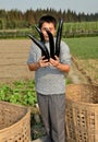 Wan Jia, China: Man with Eggplants Royalty Free Stock Photo