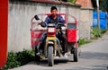Wan Jia Village, China: Farmer Driving Along Roadway
