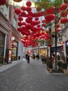 View of decorative lanterns hanging between buildings welcoming Chinese New Year on Lee Tung Avenue, Wan Chai, Hong Kong.