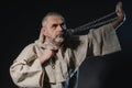 Wandering militant monk practicing a martial art with a chain in his hands