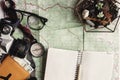 wanderlust and adventure concept, compass camera glasses passport money notebook lying on map, top view, space for text, vintage Royalty Free Stock Photo