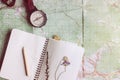 Wanderlust and adventure concept, compass and notebook with wild