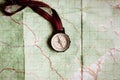 wanderlust and explore concept, compass on map, top view, vintage toned image, space for text Royalty Free Stock Photo