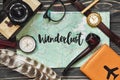 Wanderlust text sign on map. travel concept, hipster flat lay. p Royalty Free Stock Photo